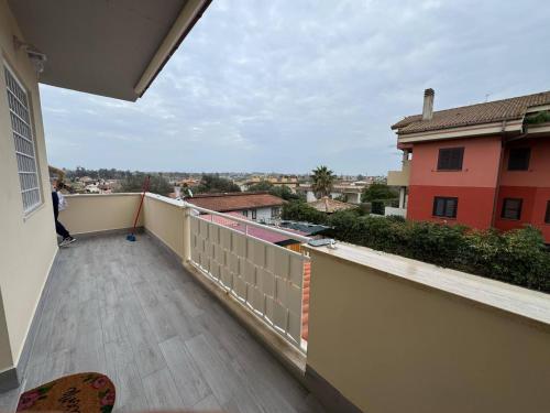 a balcony with a person standing on a balcony at La Casetta di Elena in LʼAmericano