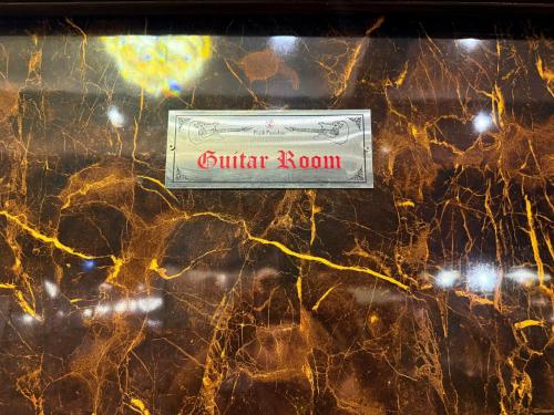 a dollar bill sitting on top of a marble wall at Popli Paradise Resort in Jaipur