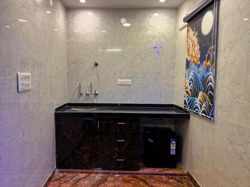 a bathroom with a sink and a mirror at Popli Paradise Resort in Jaipur