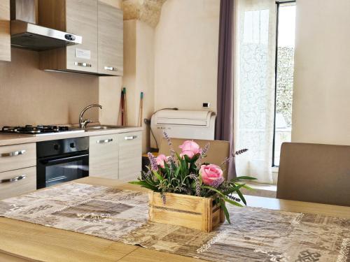 Kuchyň nebo kuchyňský kout v ubytování Appartamenti inSalento San Pancrazio