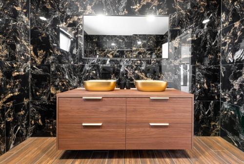 a bathroom with two sinks on a wooden dresser at Villa Marta in Makarska
