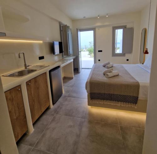 Un ou plusieurs lits dans un hébergement de l'établissement Maeva Suites Santorini