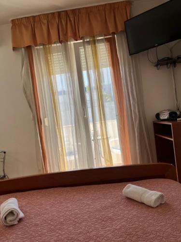Postel nebo postele na pokoji v ubytování Apartments Znjan