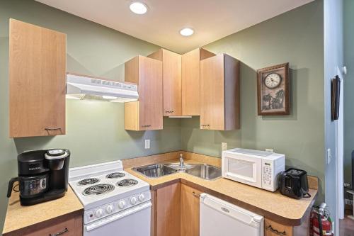 a kitchen with a sink and a microwave at Suites On Chocolate - The Zoo in Hershey