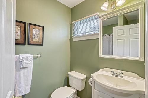 a bathroom with a white toilet and a sink at Suites On Chocolate - The Zoo in Hershey