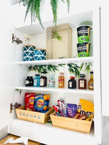 a walk in pantry with food and snacks at Studio Square - zonrijke studio - zuidgericht balkon - dichtbij strand in Middelkerke