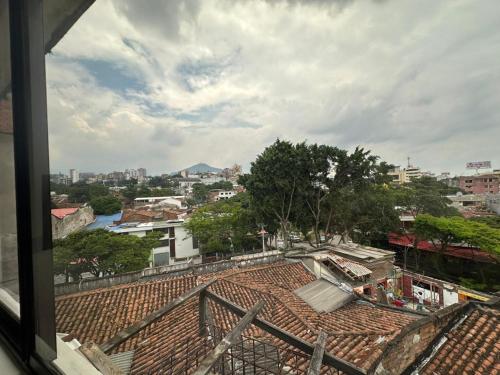 a view from a window of a city at Suite con terraza privada in Cali