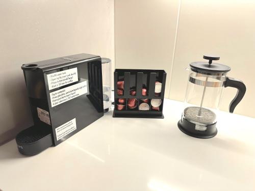 a coffee maker and a blender on a counter at The Cutest Studio in Central Tampere in Tampere