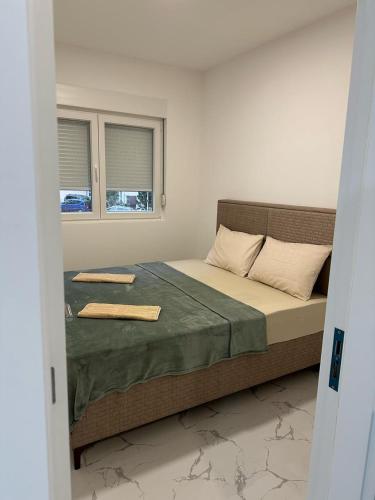 Ένα ή περισσότερα κρεβάτια σε δωμάτιο στο VANjA Apartment