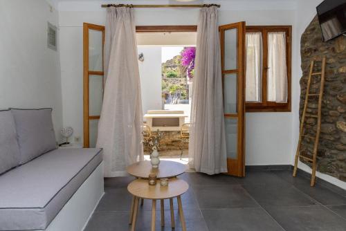 a living room with a couch and a table at Κυκλαδίτικο Studio in Kionia