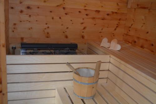 a inside of a sauna with a trash can at Hotel Alpina in Ried im Zillertal