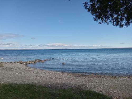 a body of water with rocks in the water at Rainbow COVE in Manitowaning