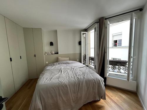 Photo de la galerie de l'établissement Appartement chambre et canapé-lit, à Paris