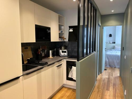 Photo de la galerie de l'établissement Appartement chambre et canapé-lit, à Paris