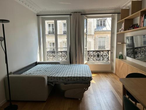 Photo de la galerie de l'établissement Appartement chambre et canapé-lit, à Paris