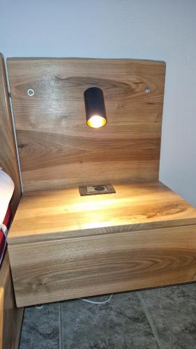 a light that is on top of a wooden desk at Freesia House in Kranidi