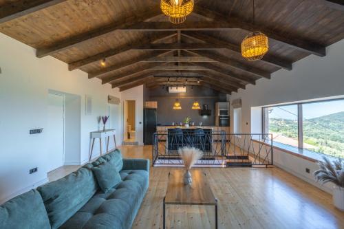 a living room with a couch and a table at Amalia Casa Lefkada in Pigadhisánoi