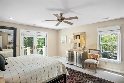 a bedroom with a bed and a ceiling fan at 735 Virginia Rail Road by Akers Ellis Rentals in Kiawah Island