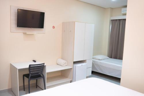 Кровать или кровати в номере Amazônia Palace Hotel