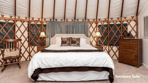 a bedroom with a bed in a tent at StoneWind Retreat in Chester