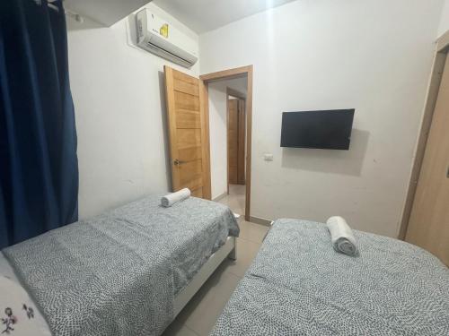Postel nebo postele na pokoji v ubytování Boca del Mar