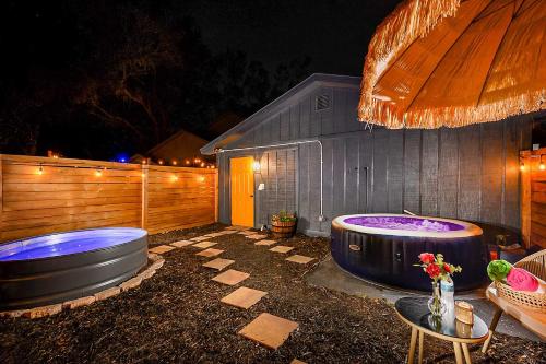 a backyard with a jacuzzi in front of a house at Private Pools and Hot Tubs Luxe Brandon Oasis! in Brandon