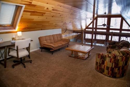 a living room with a couch and a table at Lodge on Lamoka 