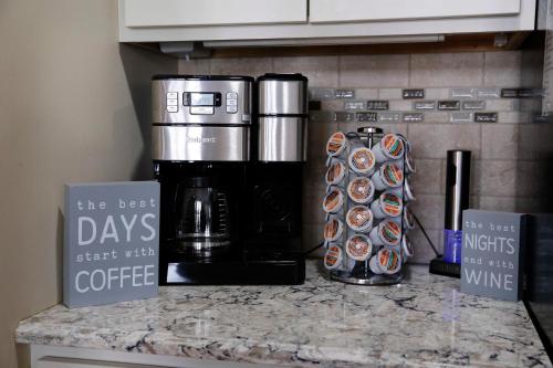 a kitchen counter with a coffeemaker and a coffee maker at Lodge on Lamoka 