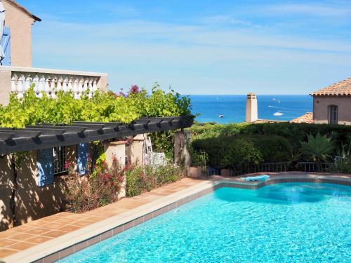 a swimming pool with a view of the ocean at Villa Riviera, Sea view, Pool, Jacuzzi, Sauna, Walk to the beach in Sainte-Maxime