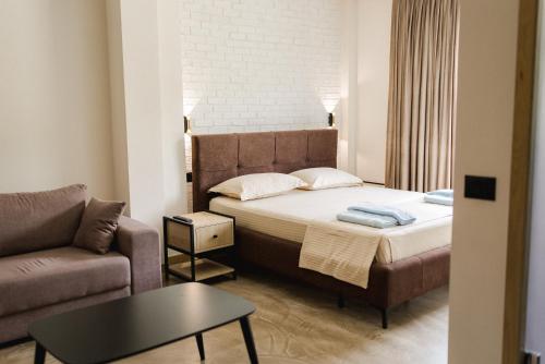 Postel nebo postele na pokoji v ubytování Ritson Hotel