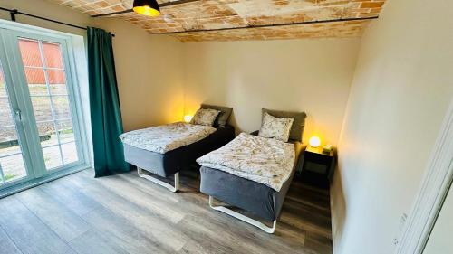 Ένα ή περισσότερα κρεβάτια σε δωμάτιο στο Bækkely Bed and Breakfast