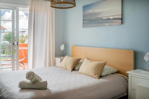 a bedroom with a bed with a view of the ocean at El Veril del Duque Apartment in Adeje