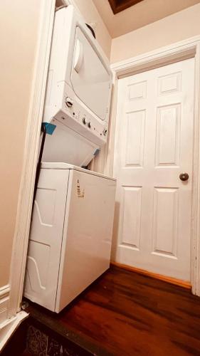 a refrigerator with its door open in a room at Downtown-Jackson Park private Budget Friendly Room in Windsor