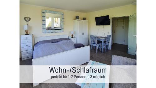 TV a/nebo společenská místnost v ubytování Strandloft Cuxhaven im Haus Frauenpreiß Sahlenburg - strandnah - 2 Hunde willkommen -Schwimmbad - Sauna - direkt am Wald - Dachterrasse mit Blick nach Neuwerk