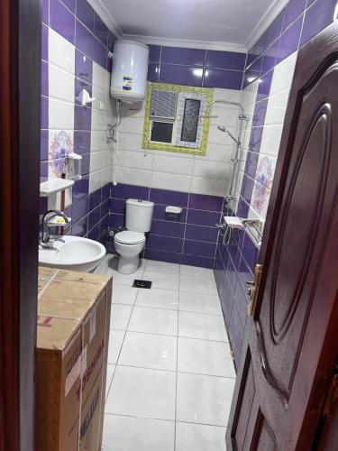 a bathroom with a toilet and a sink at الاغوار bb in Khirbat ash Shaykh Muḩammad