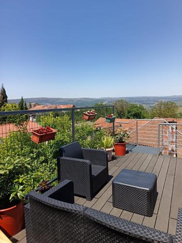 a patio with two chairs and a table on a deck at D'ouro Relax Prestige in Sanfins do Douro
