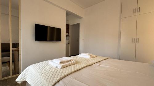 Кровать или кровати в номере Estia Luxury Apartment