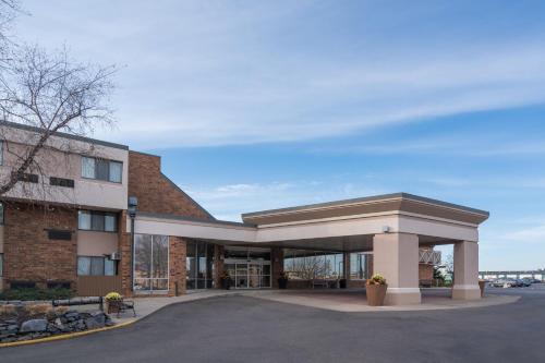 a large building with a building at Holiday Inn & Suites St. Cloud by IHG in Saint Cloud