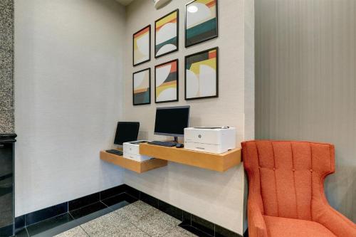 a office with a desk with a computer and a chair at Drury Inn & Suites Montgomery in Montgomery