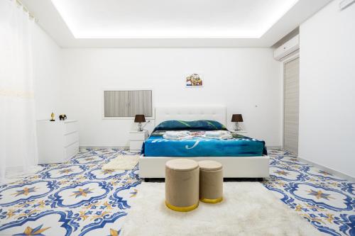 Ένα ή περισσότερα κρεβάτια σε δωμάτιο στο Max e Charlie Suites