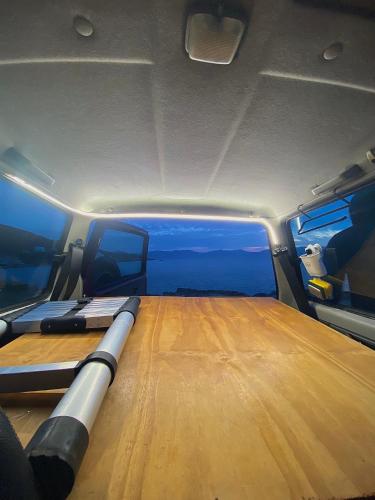 a view of the inside of a boat with a wooden floor at Σκηνή Οροφής 4χ4 όχημα in Mesochórion