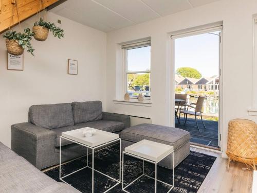 a living room with a couch and a table at Apartment Borre XII in Borre