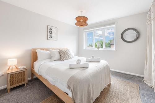 Ένα ή περισσότερα κρεβάτια σε δωμάτιο στο Saxmundham Stay: Park & Unwind