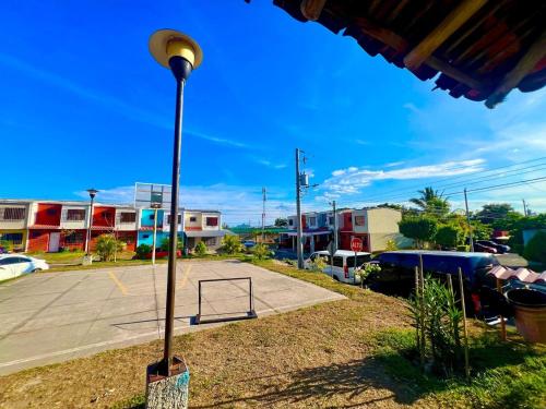 a street light sitting next to a parking lot at House in Alta Vista Complex in San Martín