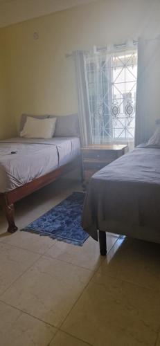 Ένα ή περισσότερα κρεβάτια σε δωμάτιο στο Bella's Cottage