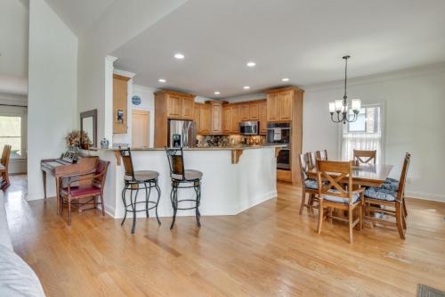 a kitchen and living room with a table and chairs at Home on Lake Lanier with Dock and Water Views in Gainesville