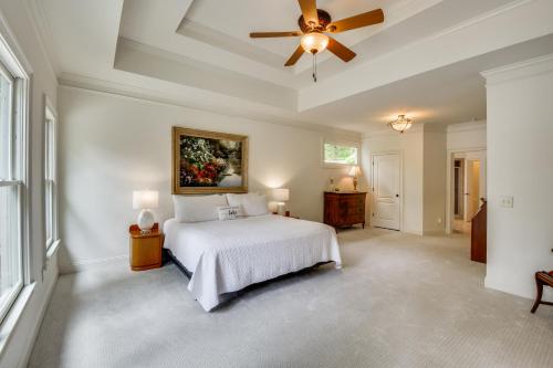 a bedroom with a bed and a ceiling fan at Home on Lake Lanier with Dock and Water Views in Gainesville