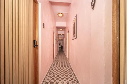an empty hallway with a tile floor in a building at Room 6 Affordable Cool in Santurce Arts Area in San Juan