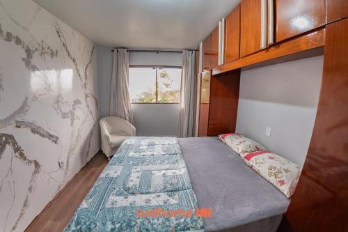 En eller flere senge i et værelse på Casa em Passo Fundo com Churrasqueira