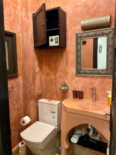 a bathroom with a toilet and a sink at House in old Medina for 10 guests in Tangier